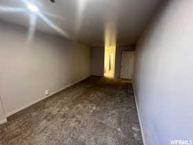 Unfurnished room with carpet flooring