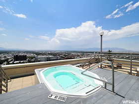 View of pool featuring an in ground hot tub