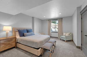 Bedroom with light colored carpet