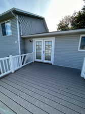 Wooden deck featuring french doors