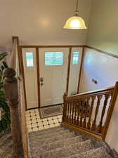 Foyer with light tile patterned floors