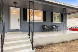 Doorway to property with a porch