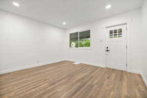 Entryway with hardwood / wood-style floors