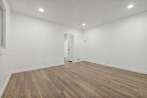 Empty room featuring hardwood / wood-style floors