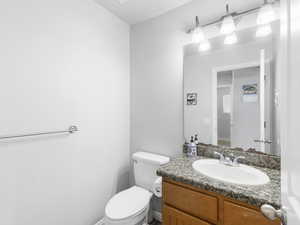 1/2 Bathroom with vanity and toilet just off from the Kitchen.