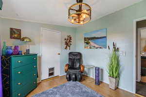 bedroom featuring a textured ceiling and light wood-type flooring