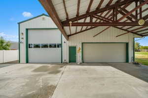 Extra large garage with pull through doors.