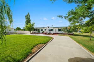 View of front of home featuring a front lawn