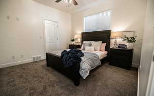 Bedroom featuring dark carpet and ceiling fan