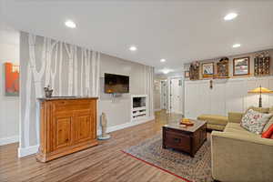 Living room with light hardwood / wood-style flooring