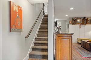 Staircase with hardwood / wood-style flooring