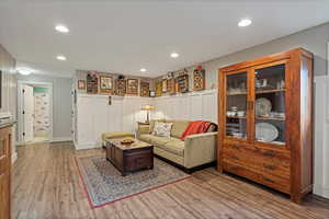 Living room with light hardwood / wood-style flooring