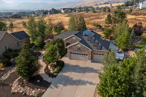 Birds eye view of property with a mountain view