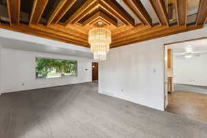 formal dining room with custom wood ceiling piece