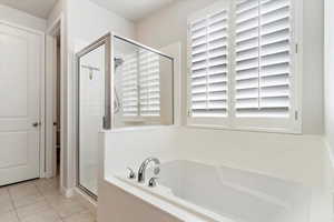 Primary Bath: Bathroom featuring tile patterned flooring and independent shower and bath