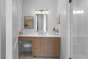 Bathroom with vanity and an enclosed shower