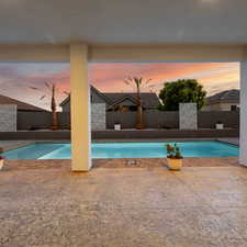 View of pool at dusk