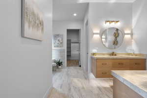 Bathroom featuring hardwood / wood-style floors and vanity