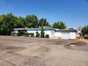 Commercial building with two rolling garage doors.