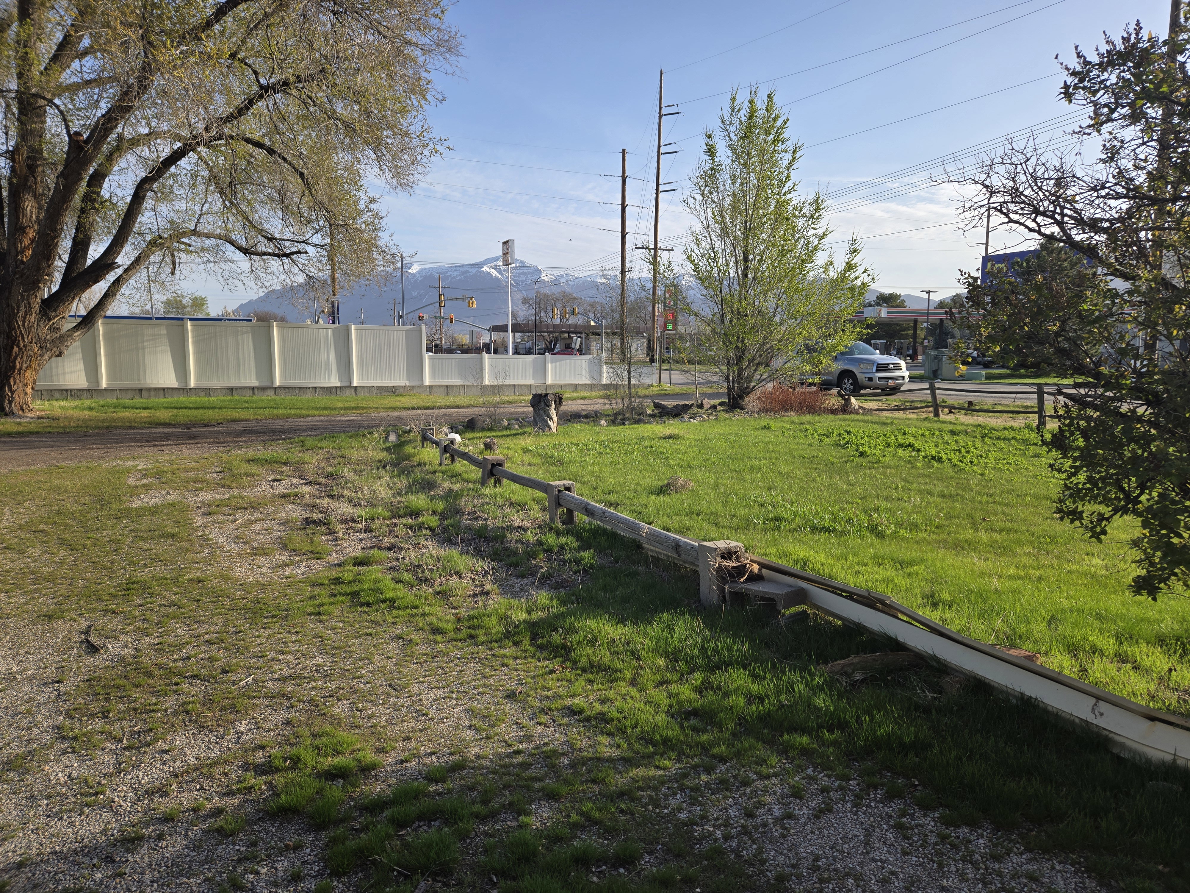 View of yard featuring a mountain view and fence