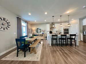 Dining room with sink and wood-type flooring