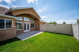 View of side yard with patio and entrance to Great Room