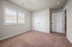 Bedroom 3 with carpet flooring,  and a closet