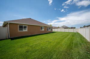 View of backyard and bedroom windows