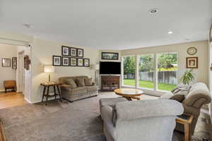 Living room with hardwood / wood-style flooring