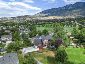 Birds eye view of property with a mountain view