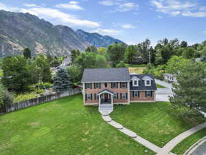 Exterior space with a mountain view and a yard