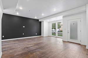 Spare room featuring hardwood / wood-style flooring