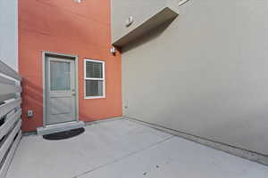 Property entrance with a patio area