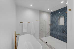 Bathroom featuring a tile shower