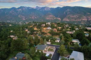 Aerial view at dusk featuring a mountain view