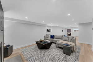 Living room with light hardwood / wood-style flooring