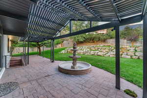 View of patio / terrace featuring a shed and a pergola