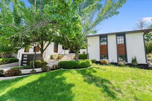 View of front of home featuring a front lawn