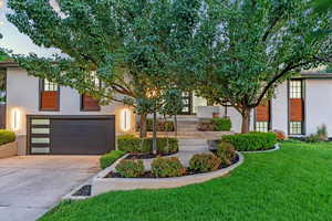 View of front facade with a garage and a front yard