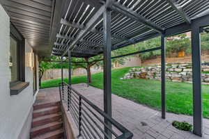 View of patio with a pergola