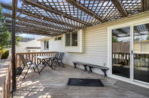 Deck featuring a pergola