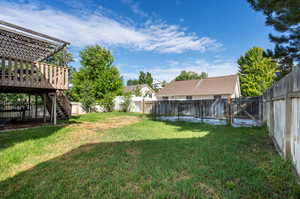 View of yard featuring a wooden deck