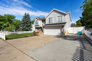 View of front facade featuring a garage