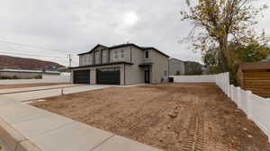 View of front of home featuring a garage