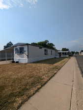 View of front of property with a front yard