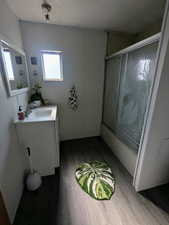 Bathroom with vanity and hardwood / wood-style flooring