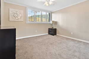 Bedroom 1: Dresser, nightstand, ceiling fan, lamp.