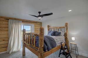 Bedroom with light colored carpet and a ceiling fan