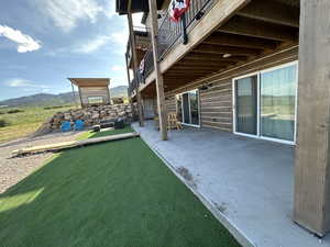 View of yard with a patio area and a mountain view