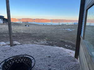 View of yard featuring a water and mountain view
